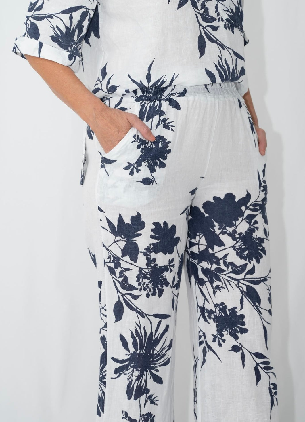 Navy floral linen outfit set showing relaxed fit top and pants