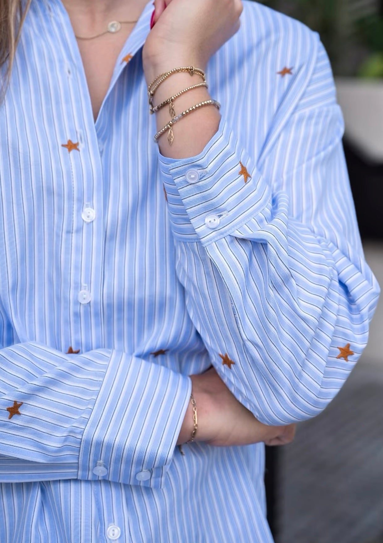 Light blue and white striped shirt with embroidered gold stars