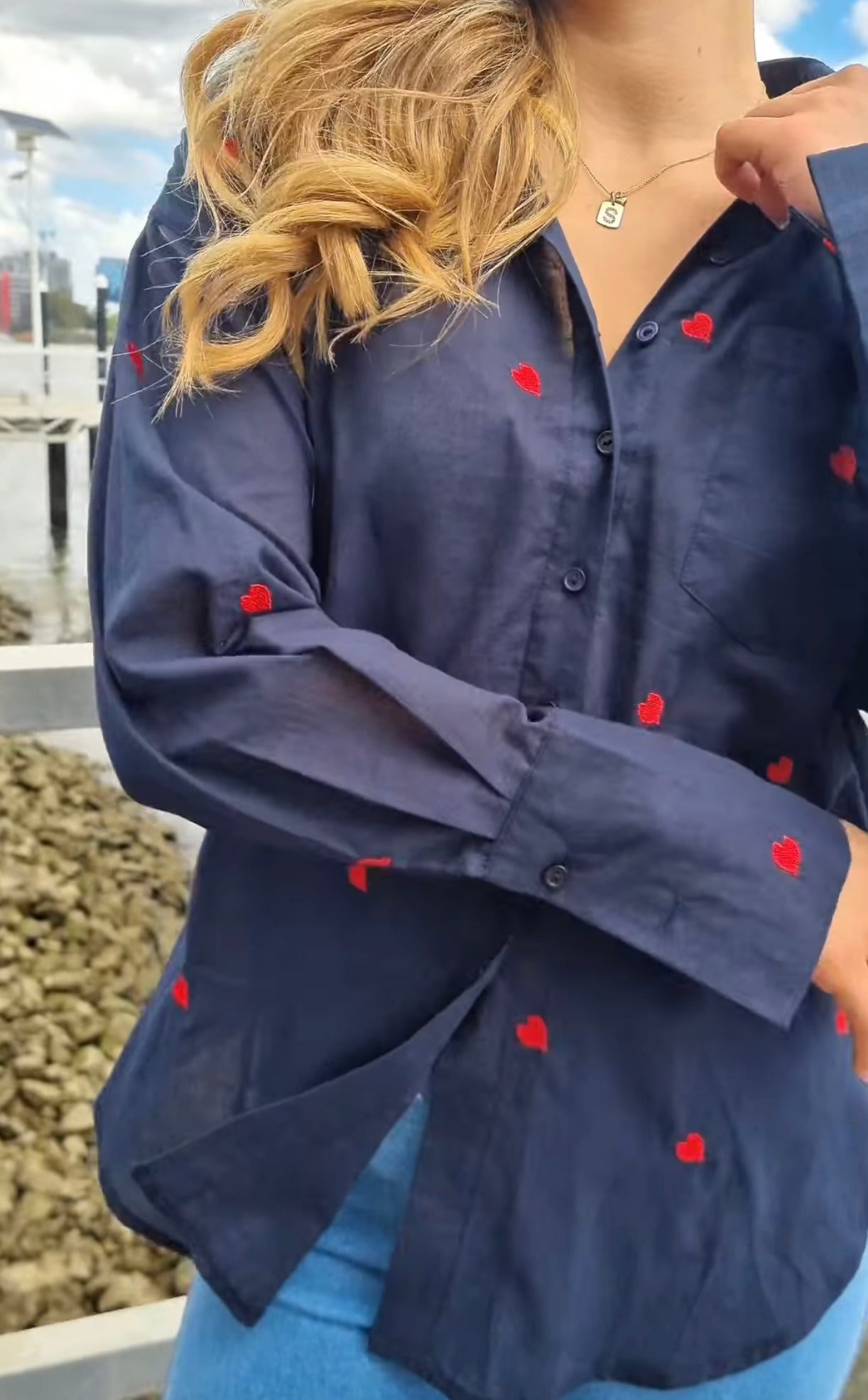 Navy blue shirt with red heart embroidery and adjustable cuffs