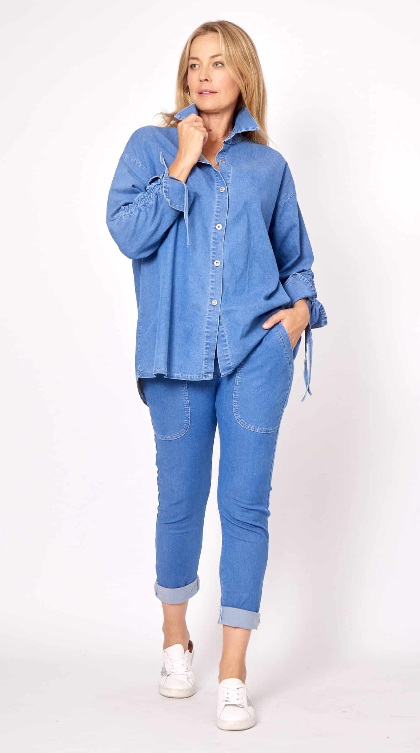 Blue denim oversized shirt paired with black stretch joggers - casual comfort outfit