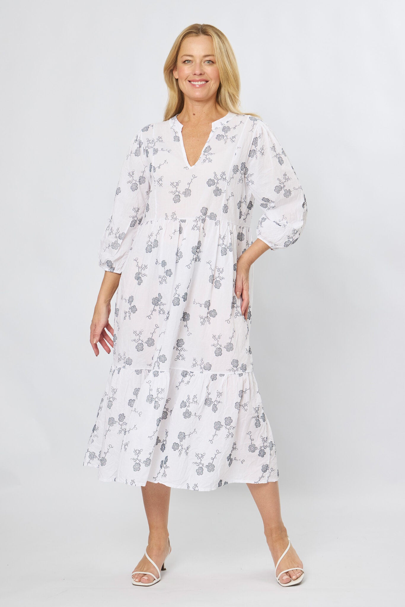 White cotton stitch print midi dress with 3/4 sleeves and tiered A-line skirt