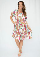 White and pink floral linen dress showing tiered skirt layers