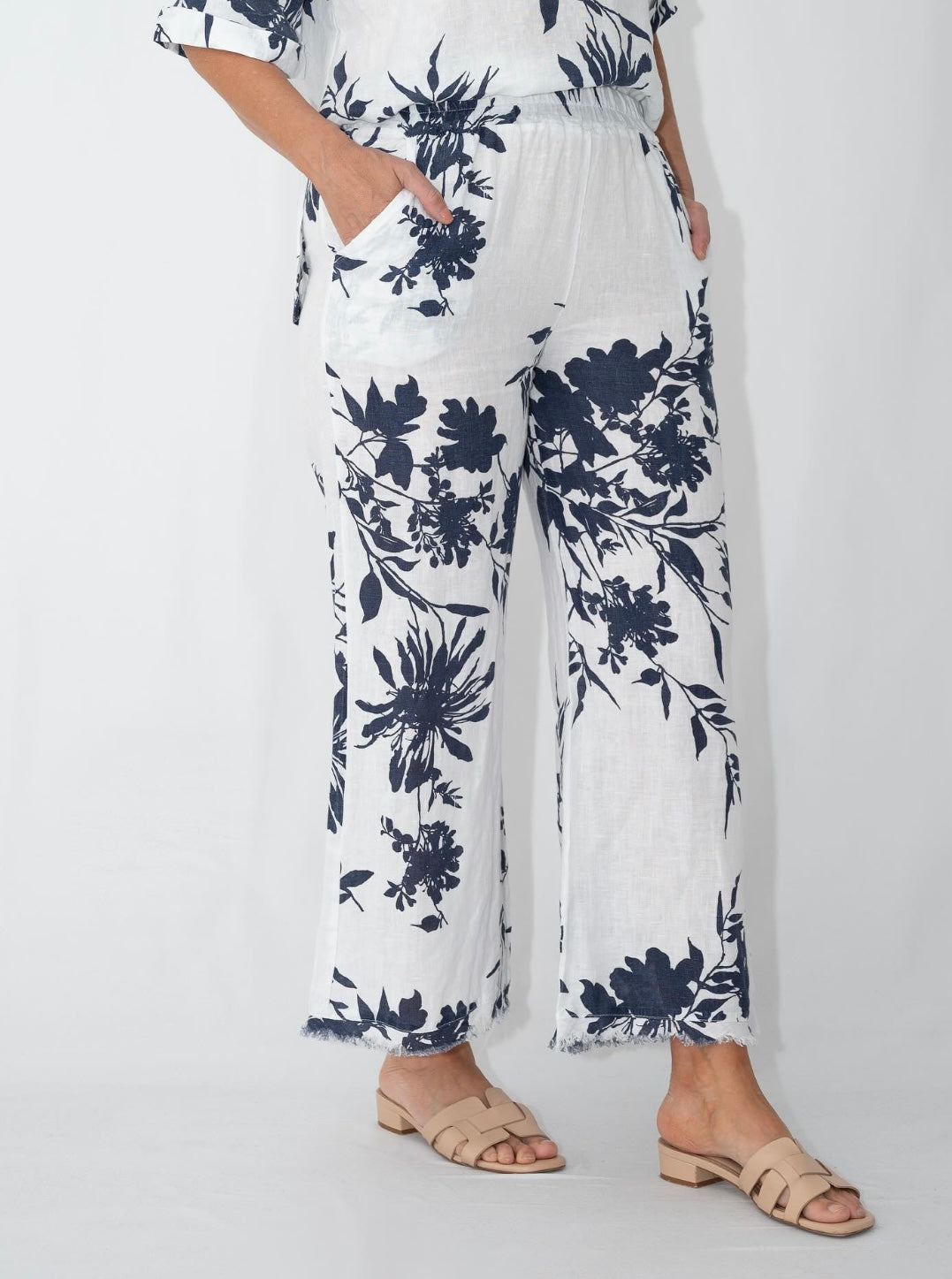 Navy floral linen outfit set showing relaxed fit top and pants