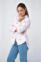 Pink and white striped shirt with embroidered red hearts