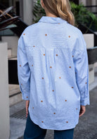 Light blue striped cotton viscose shirt with gold star embroidery