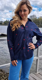 Navy shirt with embroidered red hearts and hi-lo hem