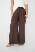 Brown wide leg pants with front pleats and elastic back waist