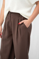 Brown wide leg pants with front pleats and elastic back waist