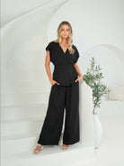 Black wide leg pleat front pants in soft viscose fabric