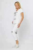 Flower Lady cotton tee showing relaxed fit and V-neckline detail