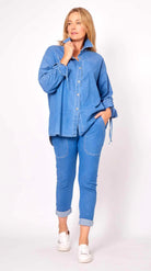 Blue denim oversized shirt paired with black stretch joggers - casual comfort outfit