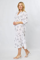 White cotton dress showing A-line silhouette and stitch print detail